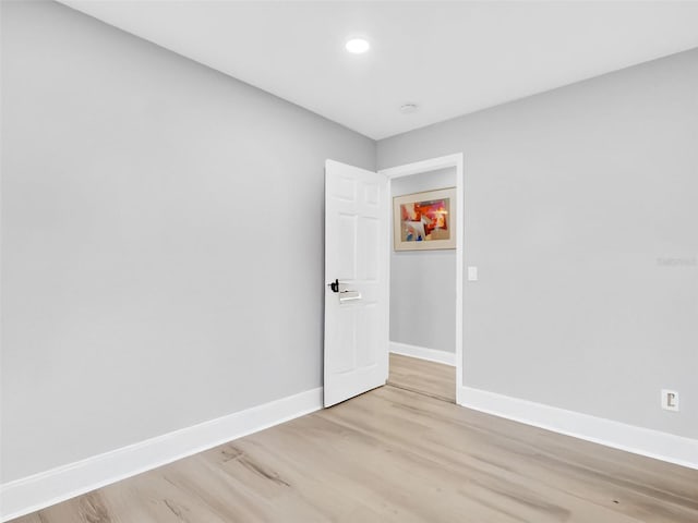 4915 S Rd, New Port Richey, FL 34652 - empty room featuring light wood-style flooring and recessed lighting