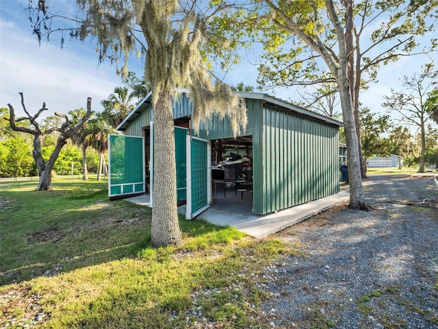 4915 S Rd, New Port Richey, FL 34652 - view of pole building with a lawn