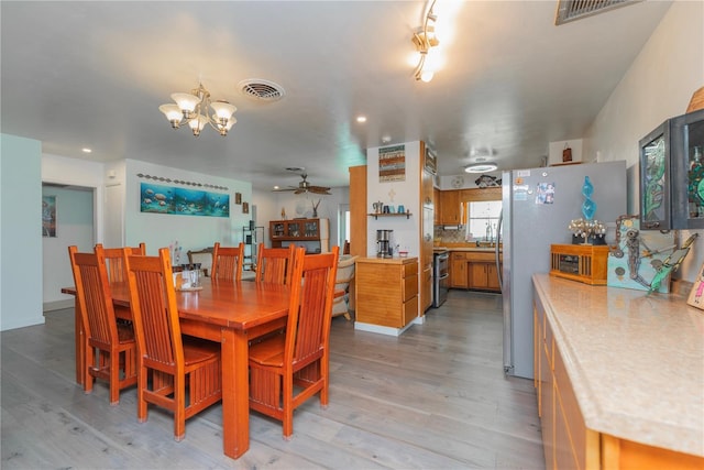 33 Cypress Dr, Palm Harbor, FL 34684 - dining area with a chandelier, light wood-style flooring, ceiling fan, and recessed lighting