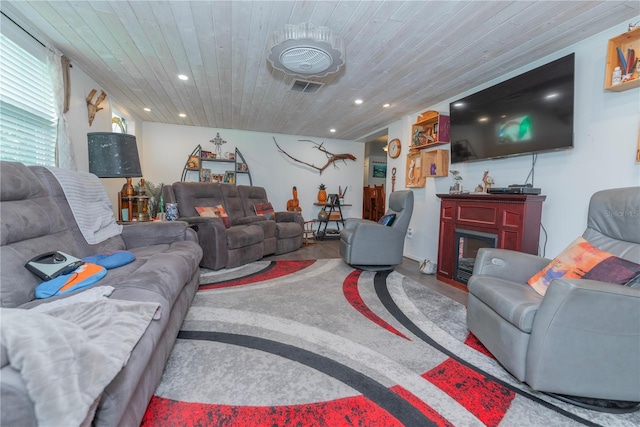 33 Cypress Dr, Palm Harbor, FL 34684 - living room featuring wood ceiling, finished concrete floors, a fireplace, and recessed lighting