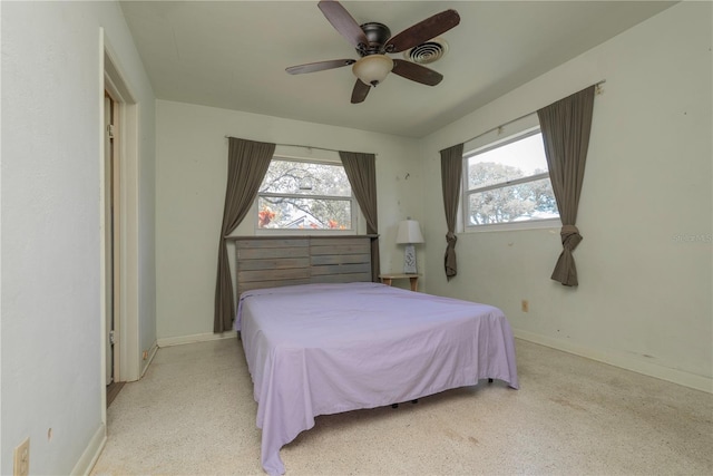 33 Cypress Dr, Palm Harbor, FL 34684 - bedroom with a ceiling fan and baseboards