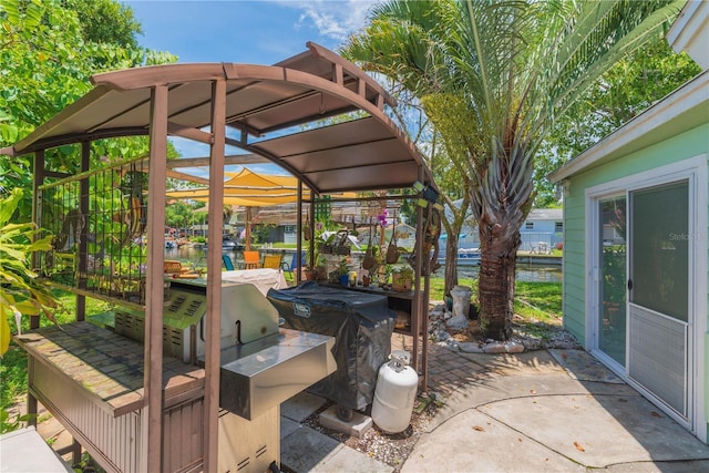 33 Cypress Dr, Palm Harbor, FL 34684 - view of patio / terrace featuring a water view