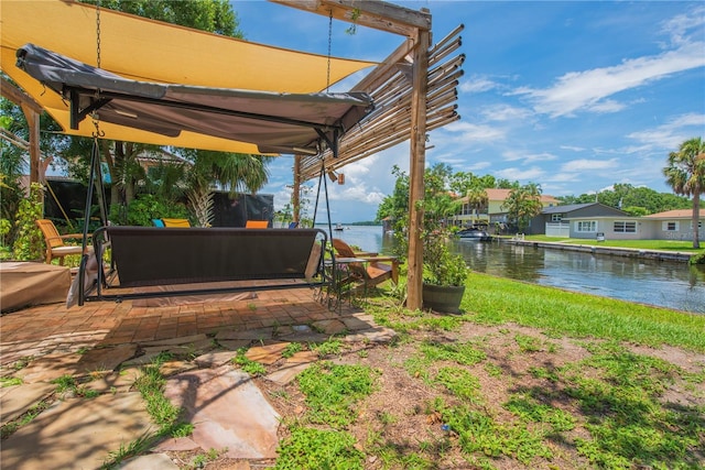 33 Cypress Dr, Palm Harbor, FL 34684 - view of yard featuring a patio, a water view, and an outdoor hangout area