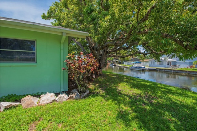 33 Cypress Dr, Palm Harbor, FL 34684 - view of grassy yard featuring a water view
