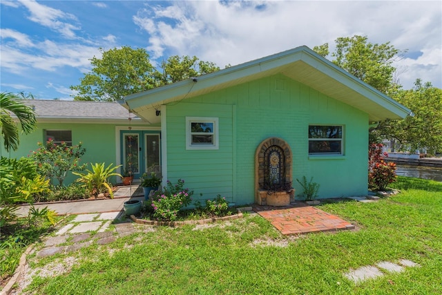 33 Cypress Dr, Palm Harbor, FL 34684 - view of front of house featuring a front lawn