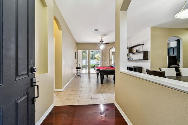 2009 Raven Manor Dr, Dover, FL 33527 - foyer featuring arched walkways, billiards table, and light wood-style floors