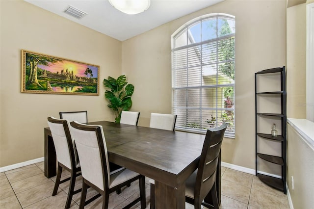 2009 Raven Manor Dr, Dover, FL 33527 - dining area featuring light tile patterned flooring and baseboards