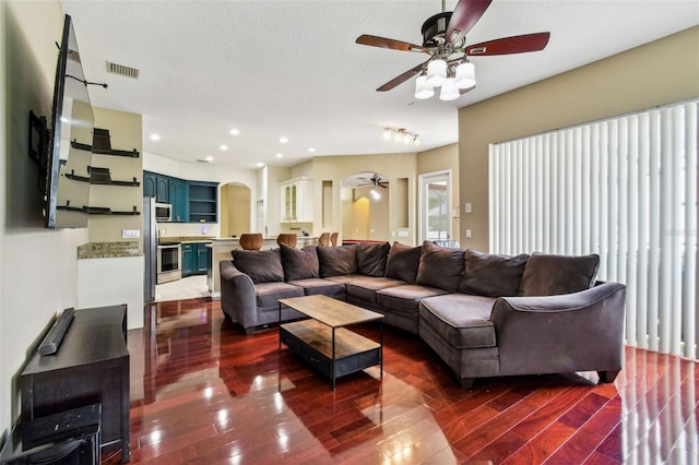 2009 Raven Manor Dr, Dover, FL 33527 - living area featuring a ceiling fan, wood finished floors, recessed lighting, and arched walkways