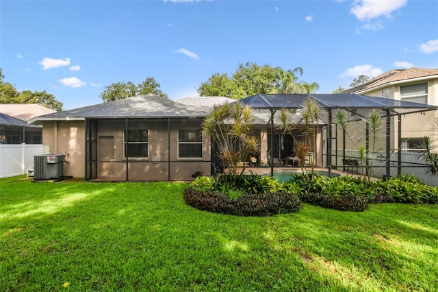 2009 Raven Manor Dr, Dover, FL 33527 - back of house featuring an outdoor pool and glass enclosure