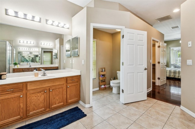 2009 Raven Manor Dr, Dover, FL 33527 - ensuite bathroom featuring tile patterned floors, vanity, and a shower with shower door