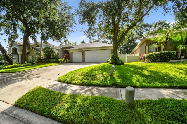 2009 Raven Manor Dr, Dover, FL 33527 - single story home with concrete driveway, stucco siding, and a garage
