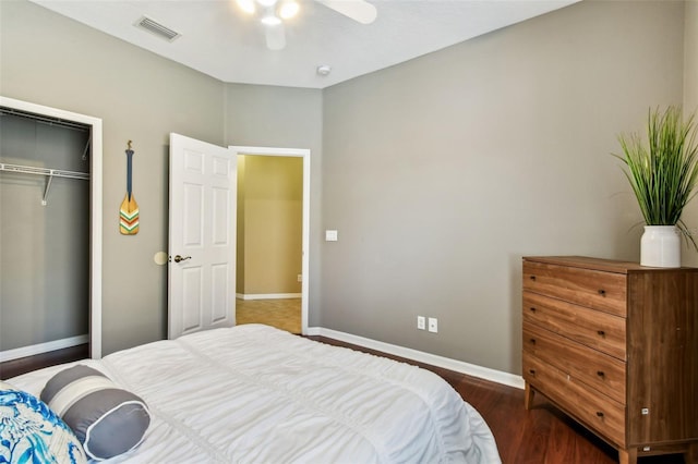2009 Raven Manor Dr, Dover, FL 33527 - bedroom with a closet, wood finished floors, and ceiling fan