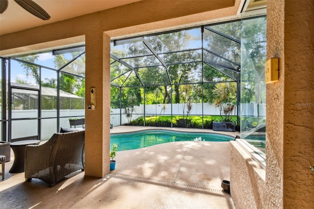 2009 Raven Manor Dr, Dover, FL 33527 - view of swimming pool with a patio, a ceiling fan, a fenced backyard, and a lanai