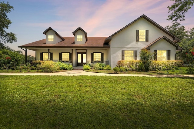 2702 Rogers Ranch Rd, Lithia, FL 33547 - view of front of home featuring a yard, a porch, and stucco siding