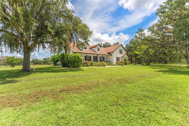 2702 Rogers Ranch Rd, Lithia, FL 33547 - cape cod home with a front lawn and stucco siding