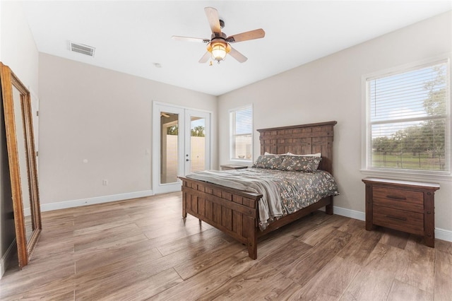 2702 Rogers Ranch Rd, Lithia, FL 33547 - bedroom featuring access to outside, light wood finished floors, french doors, and a ceiling fan