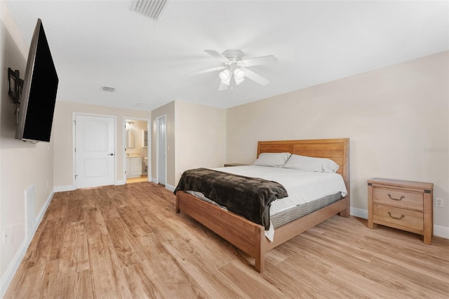2702 Rogers Ranch Rd, Lithia, FL 33547 - bedroom featuring light wood finished floors, ensuite bathroom, and a ceiling fan