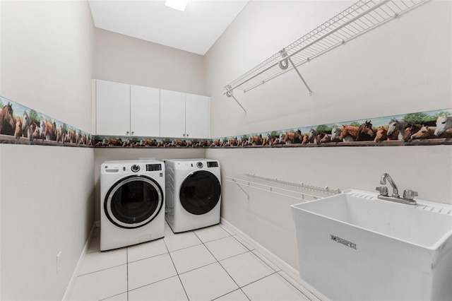 2702 Rogers Ranch Rd, Lithia, FL 33547 - washroom with cabinet space, washing machine and clothes dryer, and light tile patterned floors