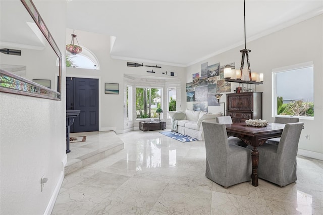 17001 NW 20th St, Pembroke Pines, FL 33028 - dining space featuring marble tiled floors, ornamental molding, and a chandelier