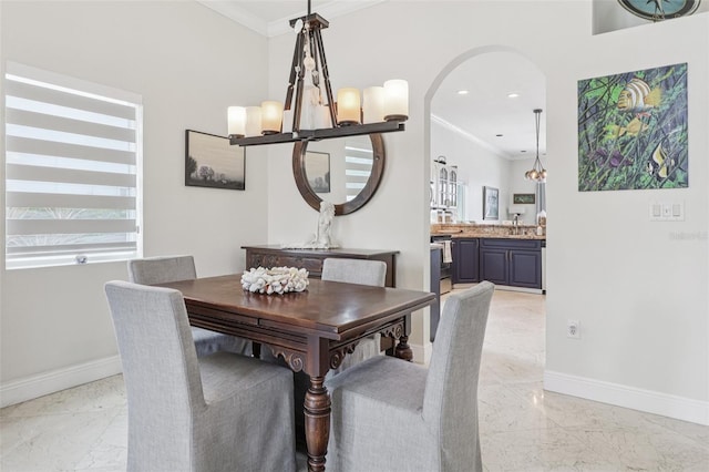 17001 NW 20th St, Pembroke Pines, FL 33028 - dining space with light marble finish floors, crown molding, arched walkways, and recessed lighting