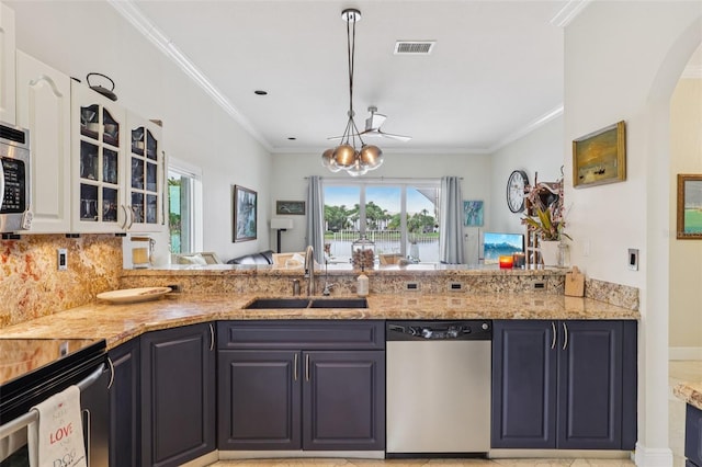 17001 NW 20th St, Pembroke Pines, FL 33028 - kitchen with dishwasher, a chandelier, glass insert cabinets, light stone counters, and crown molding