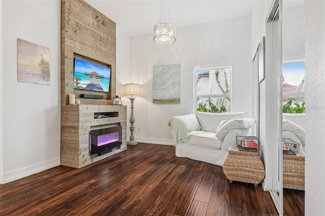 17001 NW 20th St, Pembroke Pines, FL 33028 - living area with wood finished floors, a fireplace, healthy amount of natural light, and a chandelier