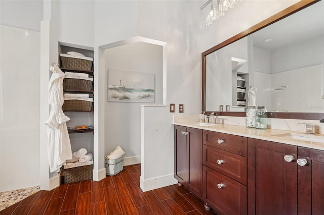 17001 NW 20th St, Pembroke Pines, FL 33028 - bathroom featuring double vanity, wood finished floors, and a shower