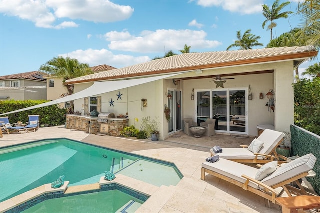 17001 NW 20th St, Pembroke Pines, FL 33028 - rear view of house with an outdoor kitchen, a patio area, a tiled roof, stucco siding, and ceiling fan