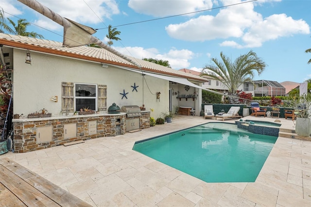 17001 NW 20th St, Pembroke Pines, FL 33028 - view of pool featuring an outdoor kitchen, a patio area, and a pool with connected hot tub