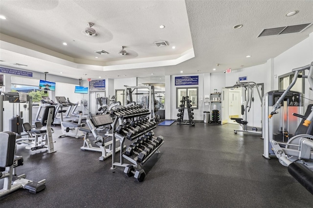 17001 NW 20th St, Pembroke Pines, FL 33028 - exercise room featuring a textured ceiling, recessed lighting, and a tray ceiling