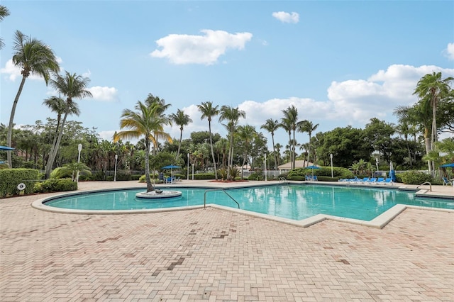 17001 NW 20th St, Pembroke Pines, FL 33028 - community pool featuring a patio area and view of scattered trees