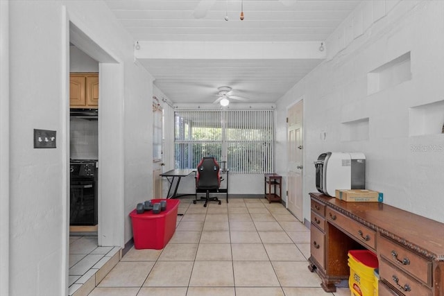 1222 Palm St, Clearwater, FL 33755 - kitchen with ceiling fan, light tile patterned floors, oven, a desk, and dark countertops