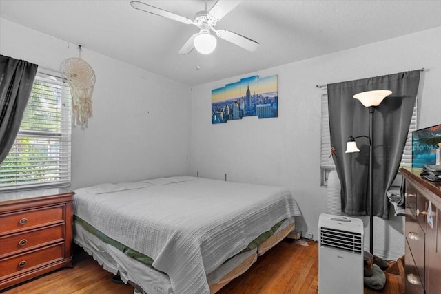 1222 Palm St, Clearwater, FL 33755 - bedroom with wood finished floors and a ceiling fan