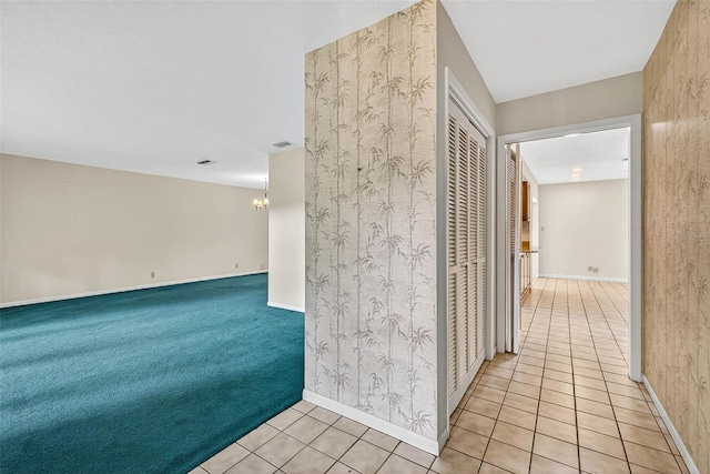 524 Garrard Dr, Temple Terrace, FL 33617 - corridor featuring tile patterned flooring and a chandelier