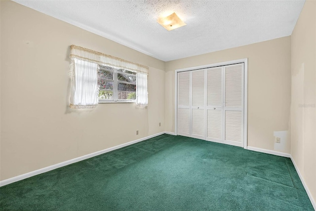 524 Garrard Dr, Temple Terrace, FL 33617 - unfurnished bedroom with carpet, a textured ceiling, and a closet
