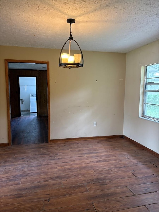 1214 Mitchell St, Brandon, FL 33511 - empty room featuring washer / clothes dryer, wood finished floors, and a textured ceiling