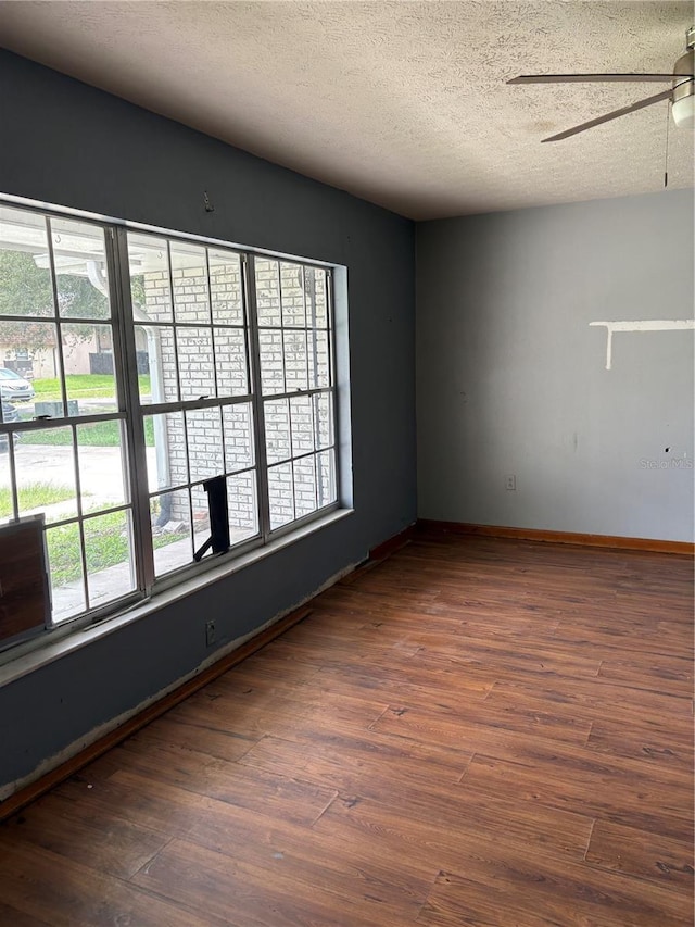 1214 Mitchell St, Brandon, FL 33511 - spare room featuring a textured ceiling, a ceiling fan, plenty of natural light, and wood finished floors