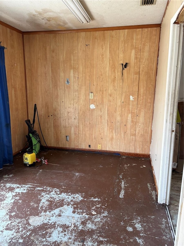 1214 Mitchell St, Brandon, FL 33511 - unfurnished room with wood walls and a textured ceiling