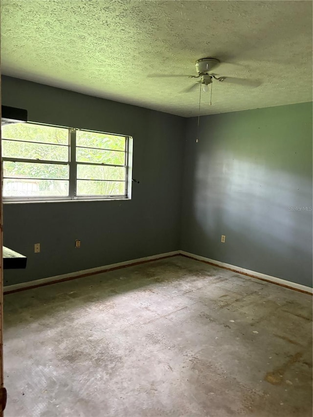1214 Mitchell St, Brandon, FL 33511 - unfurnished room featuring ceiling fan, a textured ceiling, and unfinished concrete floors