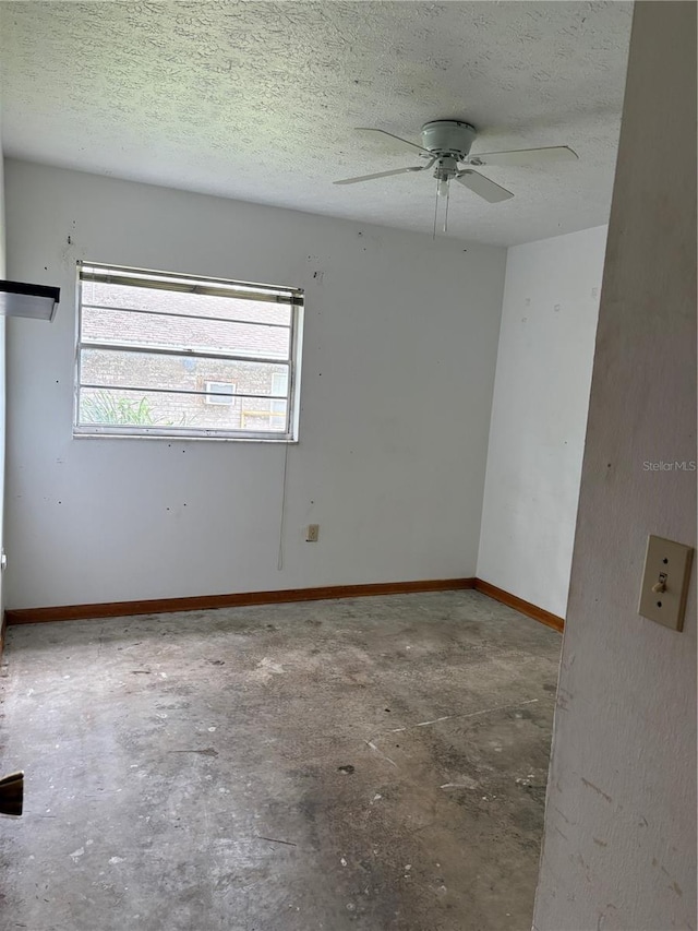 1214 Mitchell St, Brandon, FL 33511 - spare room with a ceiling fan, a textured ceiling, and concrete floors