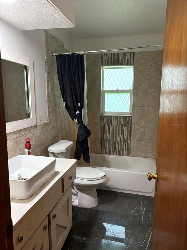 1214 Mitchell St, Brandon, FL 33511 - bathroom with vanity, shower / tub combo with curtain, and tile walls