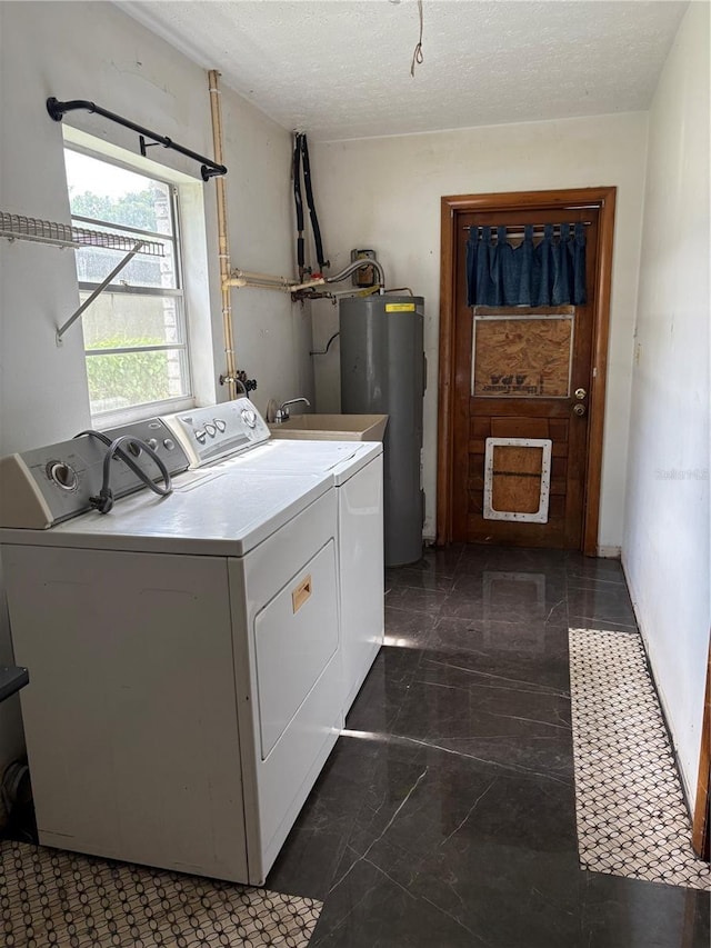 1214 Mitchell St, Brandon, FL 33511 - laundry room with separate washer and dryer, water heater, a textured ceiling, and marble finish floors