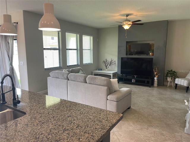 1596 Ludington Ave, Wesley Chapel, FL 33543 - living area with a ceiling fan and light tile patterned flooring