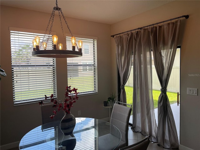 1596 Ludington Ave, Wesley Chapel, FL 33543 - dining space featuring a chandelier and plenty of natural light