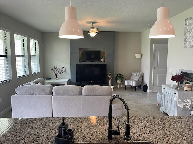 1596 Ludington Ave, Wesley Chapel, FL 33543 - living room featuring a ceiling fan and light tile patterned floors