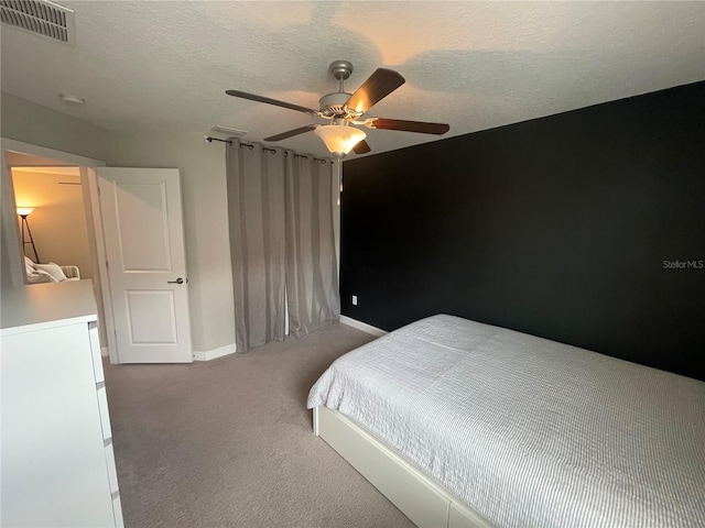 1596 Ludington Ave, Wesley Chapel, FL 33543 - bedroom featuring light colored carpet, ceiling fan, and a textured ceiling