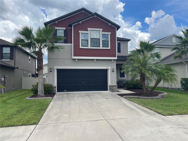 1596 Ludington Ave, Wesley Chapel, FL 33543 - view of front of property featuring stucco siding, concrete driveway, an attached garage, a front yard, and stone siding