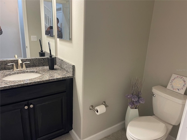 1596 Ludington Ave, Wesley Chapel, FL 33543 - half bathroom featuring vanity and tile patterned flooring