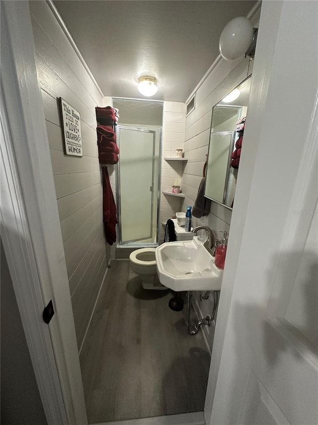609 W Main St, Wauchula, FL 33873 - bathroom featuring a stall shower and wood finished floors