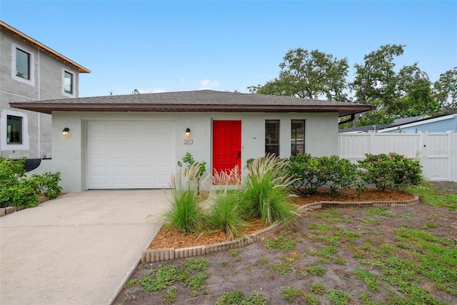 5217 29th Ave S, Gulfport, FL 33707 - view of front of home featuring stucco siding, a garage, and concrete driveway